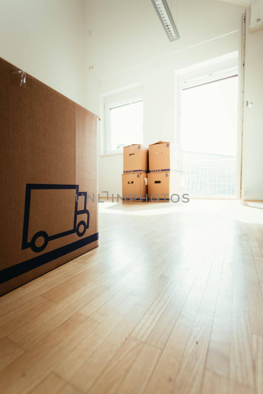 Move. Cardboard, boxes for moving into a new, clean and bright home by Daxenbichler