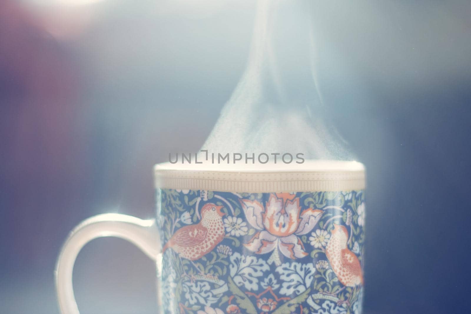 Hot steaming tea cup. Winter time.
