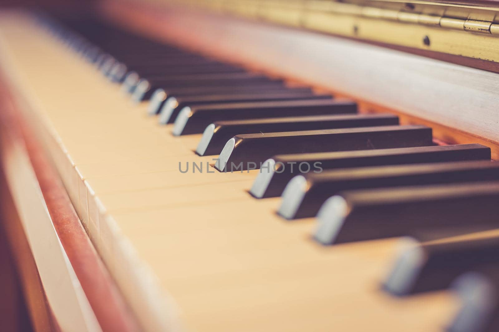 Rustic piano keys, close up picture. Classical instrument.