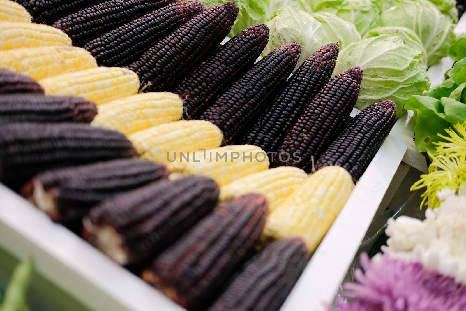 corn vegetable flower fruit on shelf at market. agriculture produce for sale