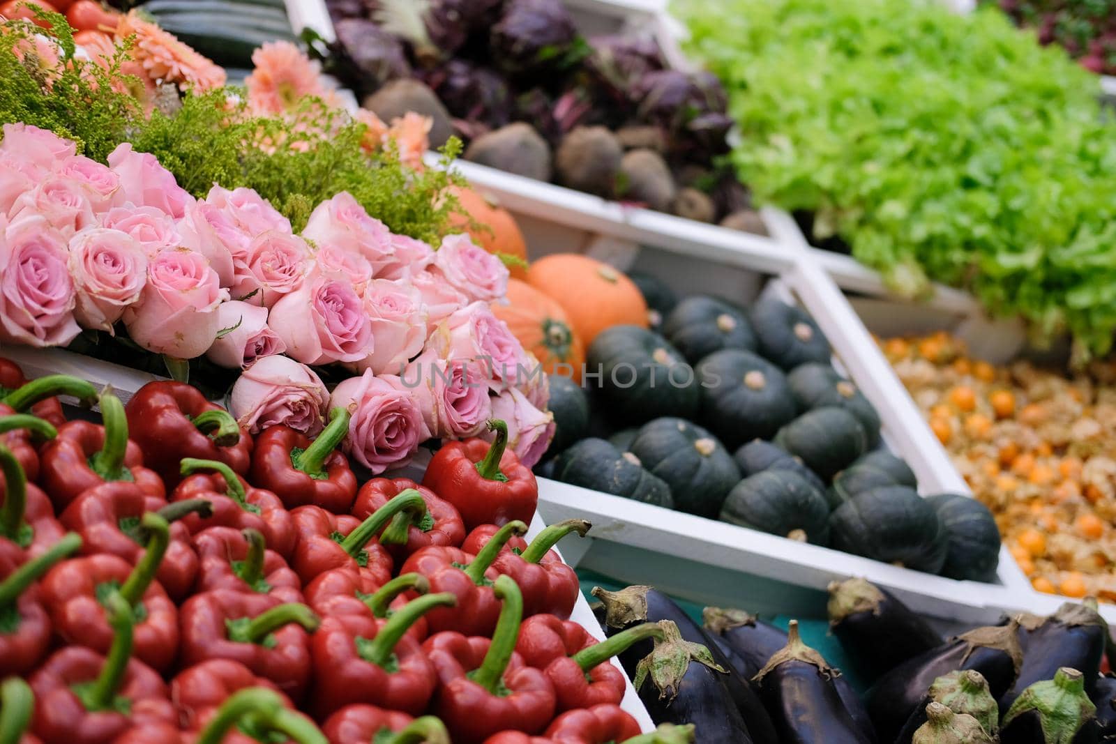 rose flower vegetable on shelf at market. agriculture produce for sale
