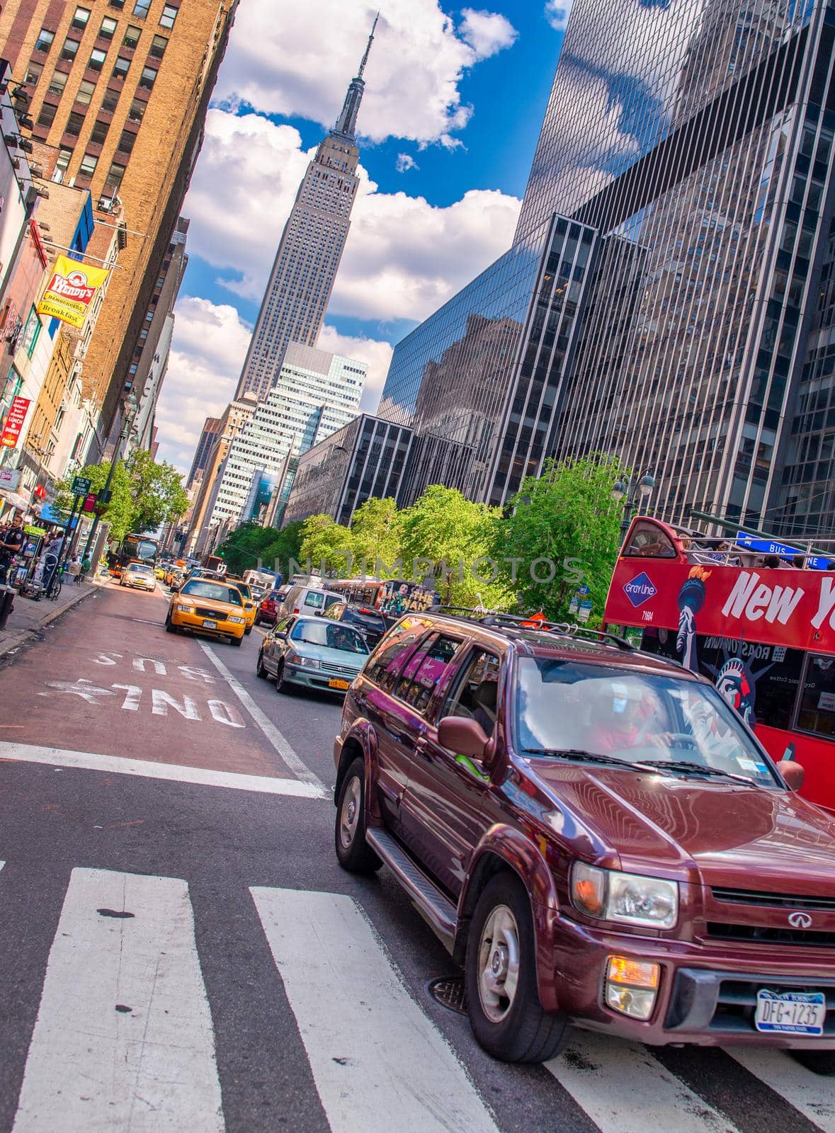 NEW YORK CITY - JUNE 11, 2013: Manhattan traffic on a hot sunny day.
