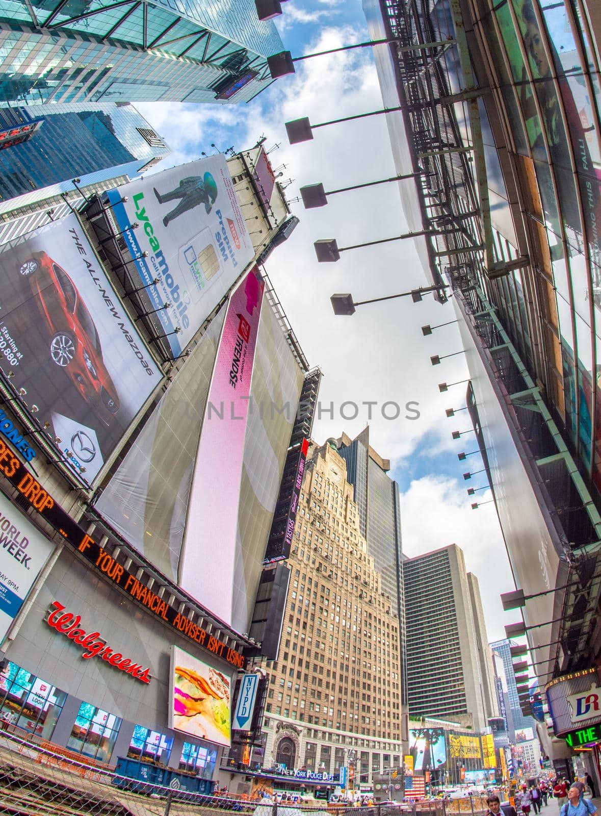 NEW YORK CITY - JUNE 11, 2013: Tourists crowded in Times Square, famous tourist attraction.