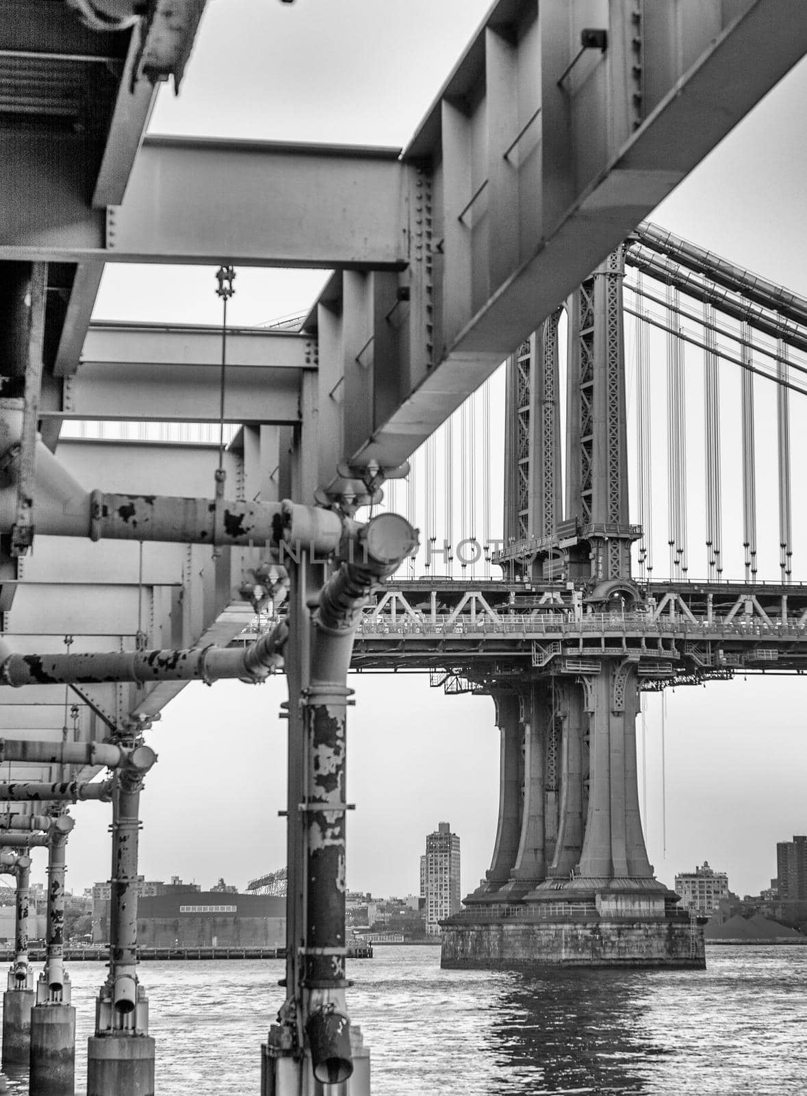 Amazing upward view ogf Manhattan Bridge in New York City on a overcast day