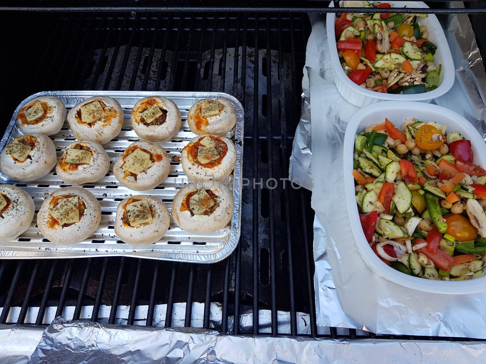 Grilled vegetables on a barbecue grill in a white bowl, top view