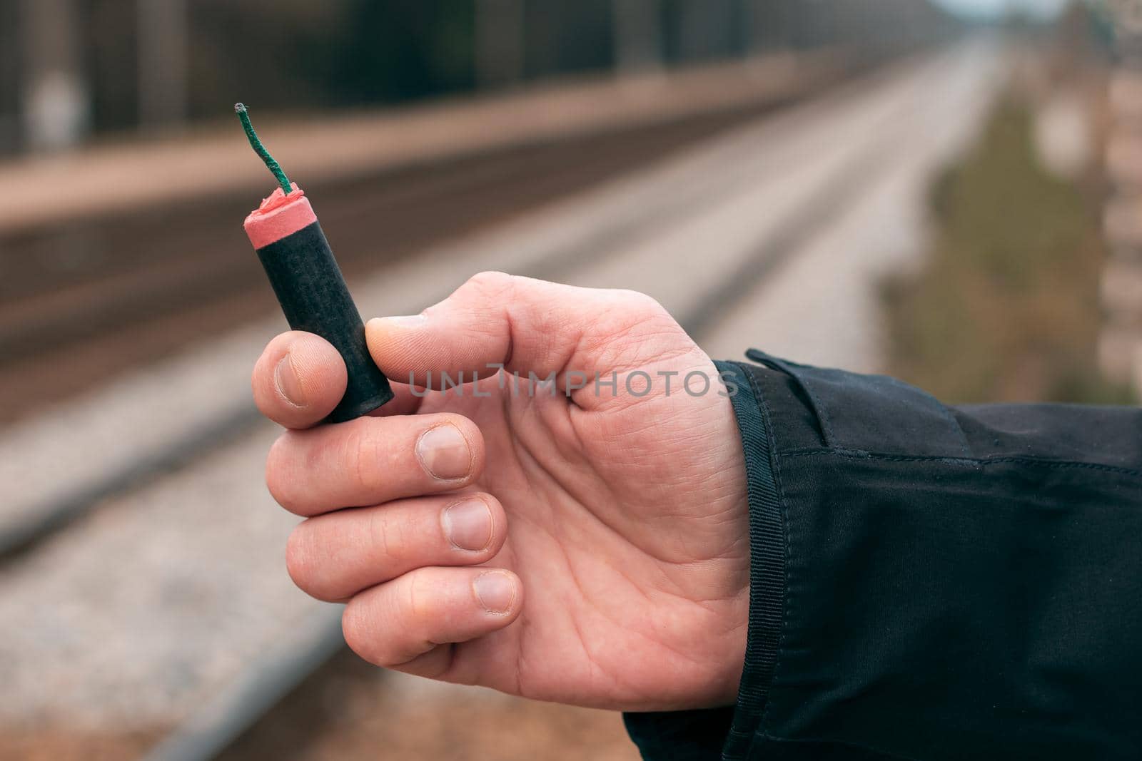 Man Holding a Firecracker in His Hand by InfinitumProdux