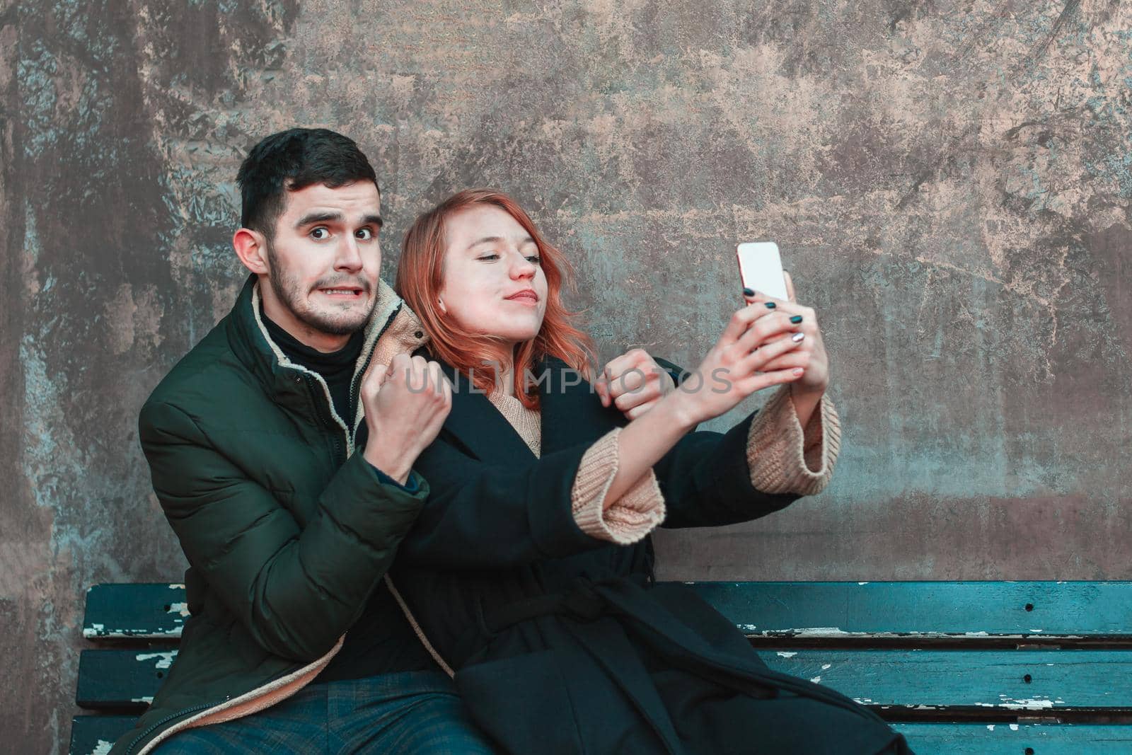 Cheerful Couple Making Selfie on the Bench by InfinitumProdux