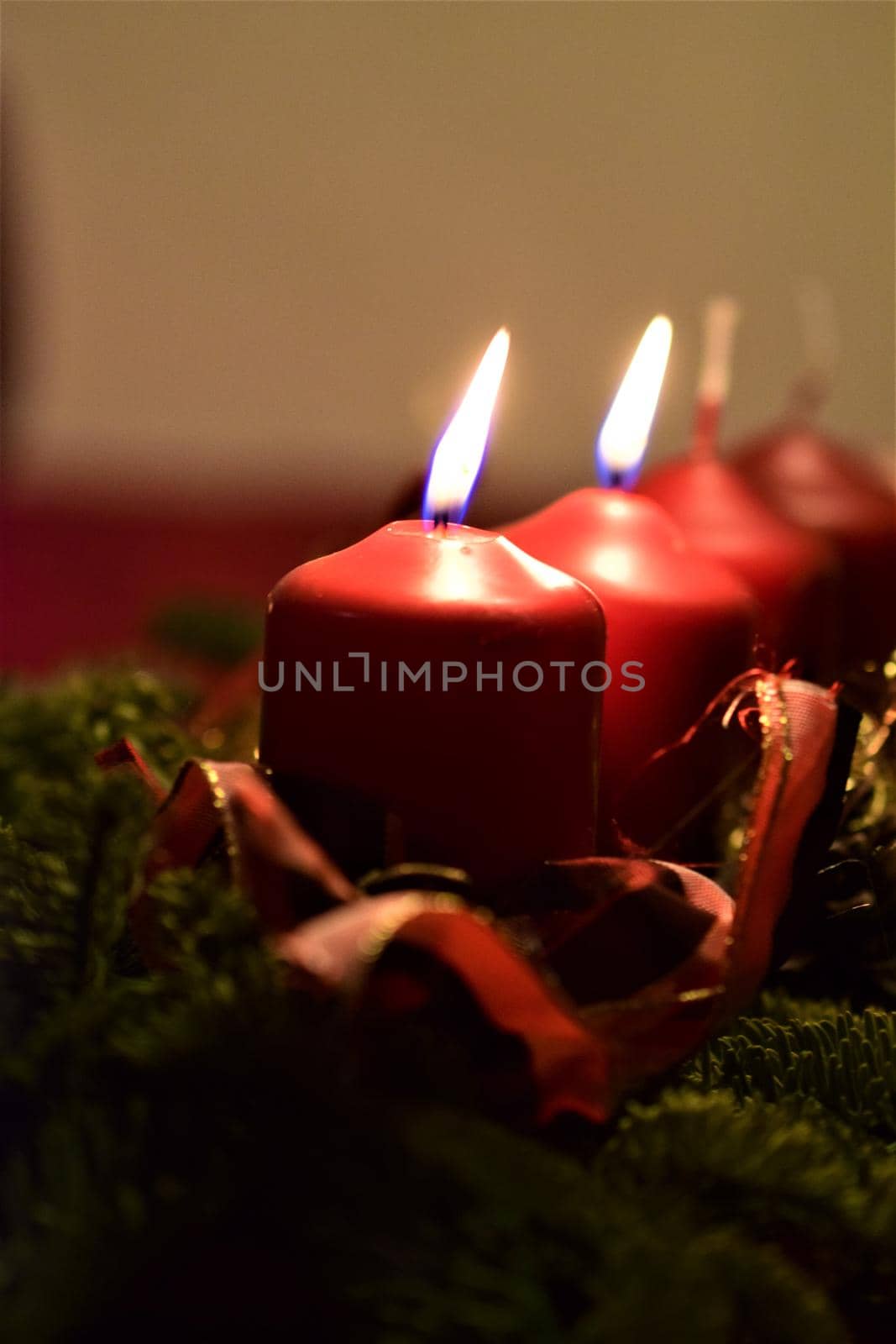 close-up of an Advent arrangement with 2 burning candles