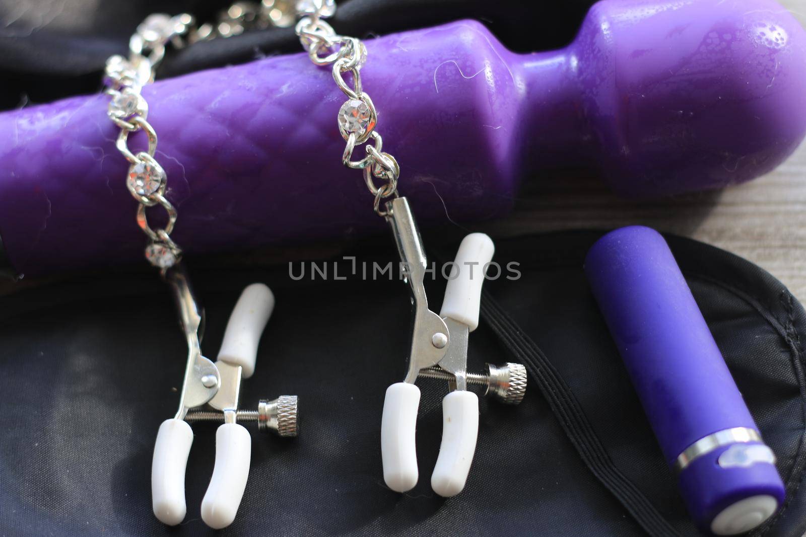 BDSM themed images showing a large dildo, nipple clamps, restraints, eye covers, and a condom by mynewturtle1