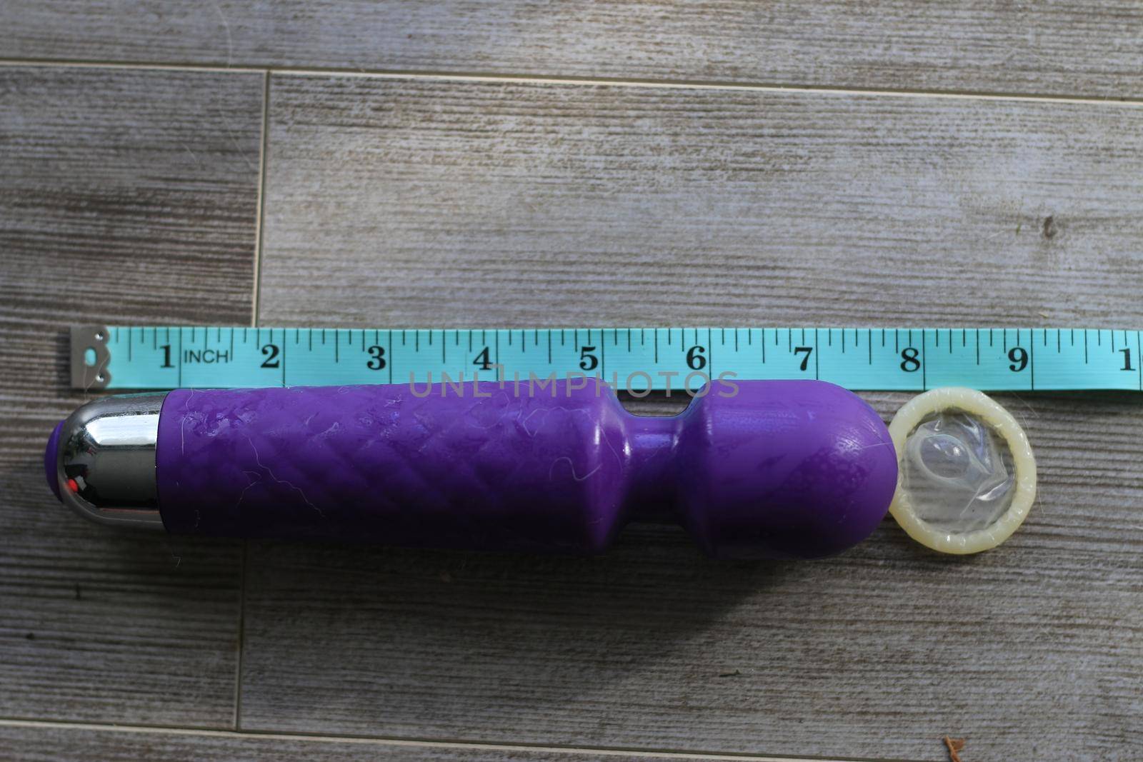 tape measurer next to a 7 inch dildo showing size by mynewturtle1