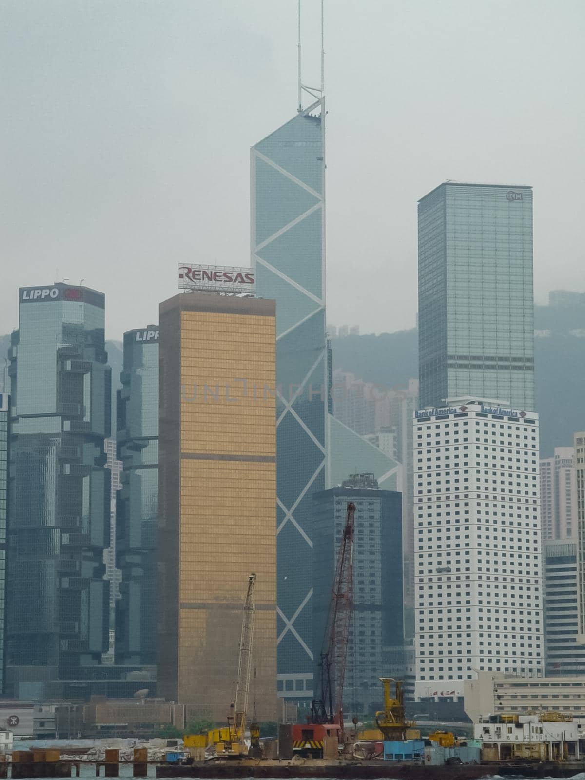 Skyscrapers of Hong Kong. The cityscape through a haze of smog over the city.