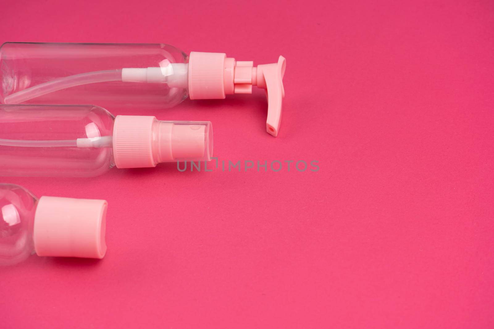 A kit of plastic containers for transportation of shampoos, creams and cosmetics in travel.