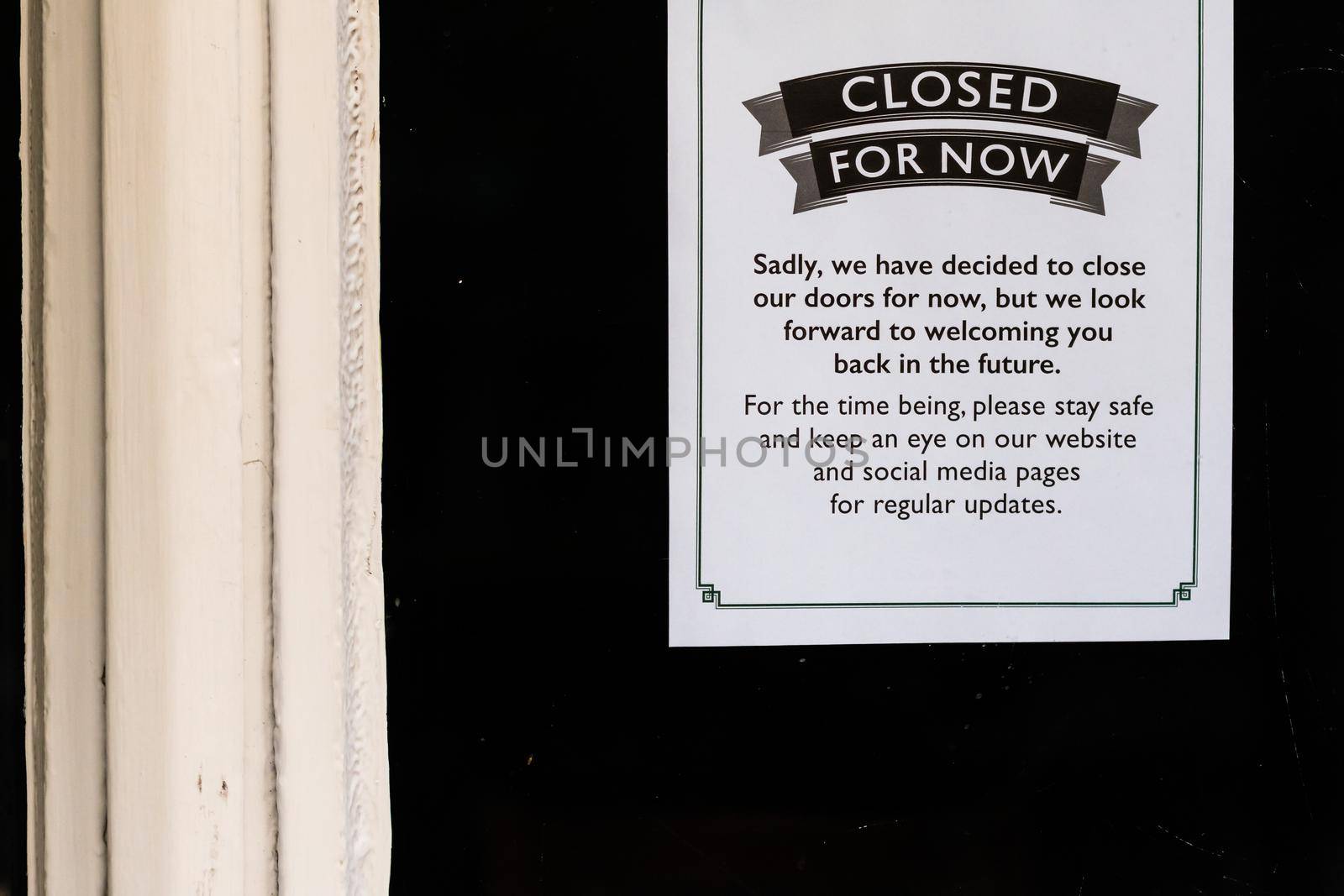 Closed for now sign on a restaurant window during lockdown caused by covid-19 pandemic