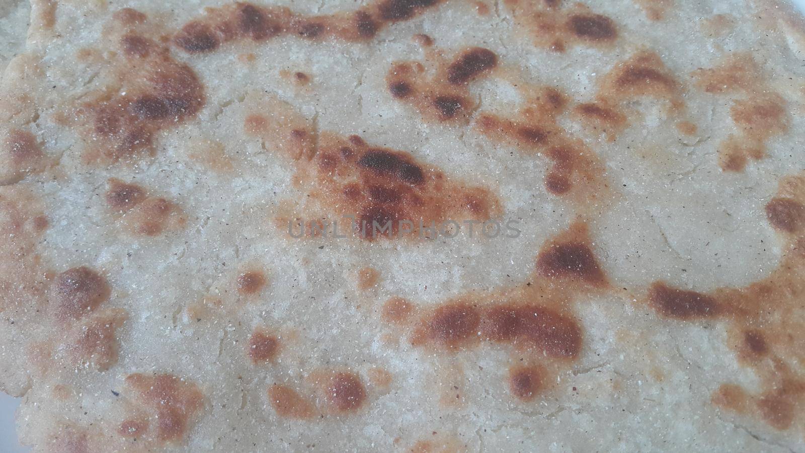 Closeup view of of traditional home made bread called Jawar roti or bhakri by Photochowk