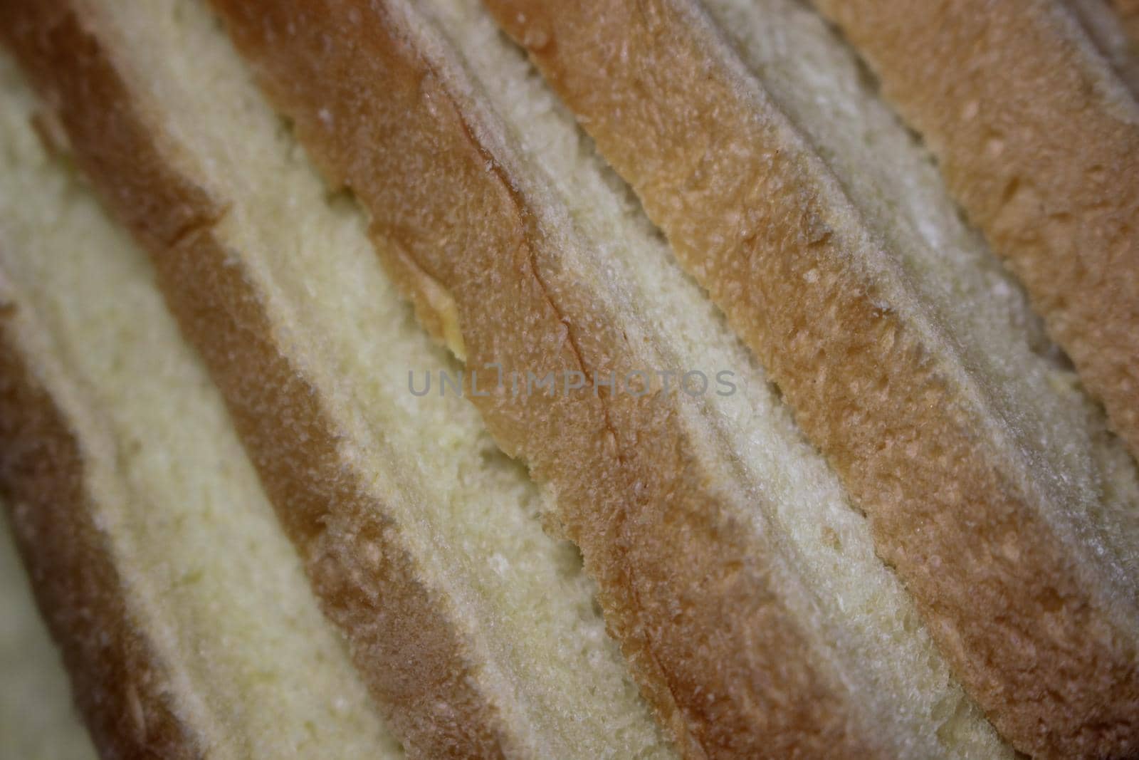 Closeup top view of freshly prepared slices of toast bread by Photochowk