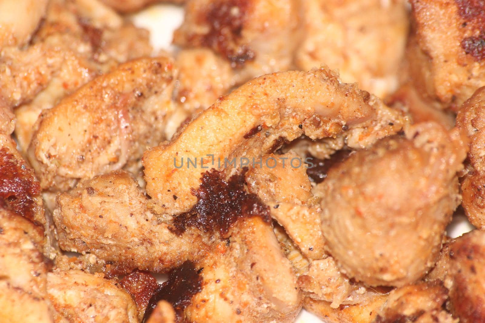 Macro closeup with selective focus on grilled chicken meat steaks. non-vegetarian concept.