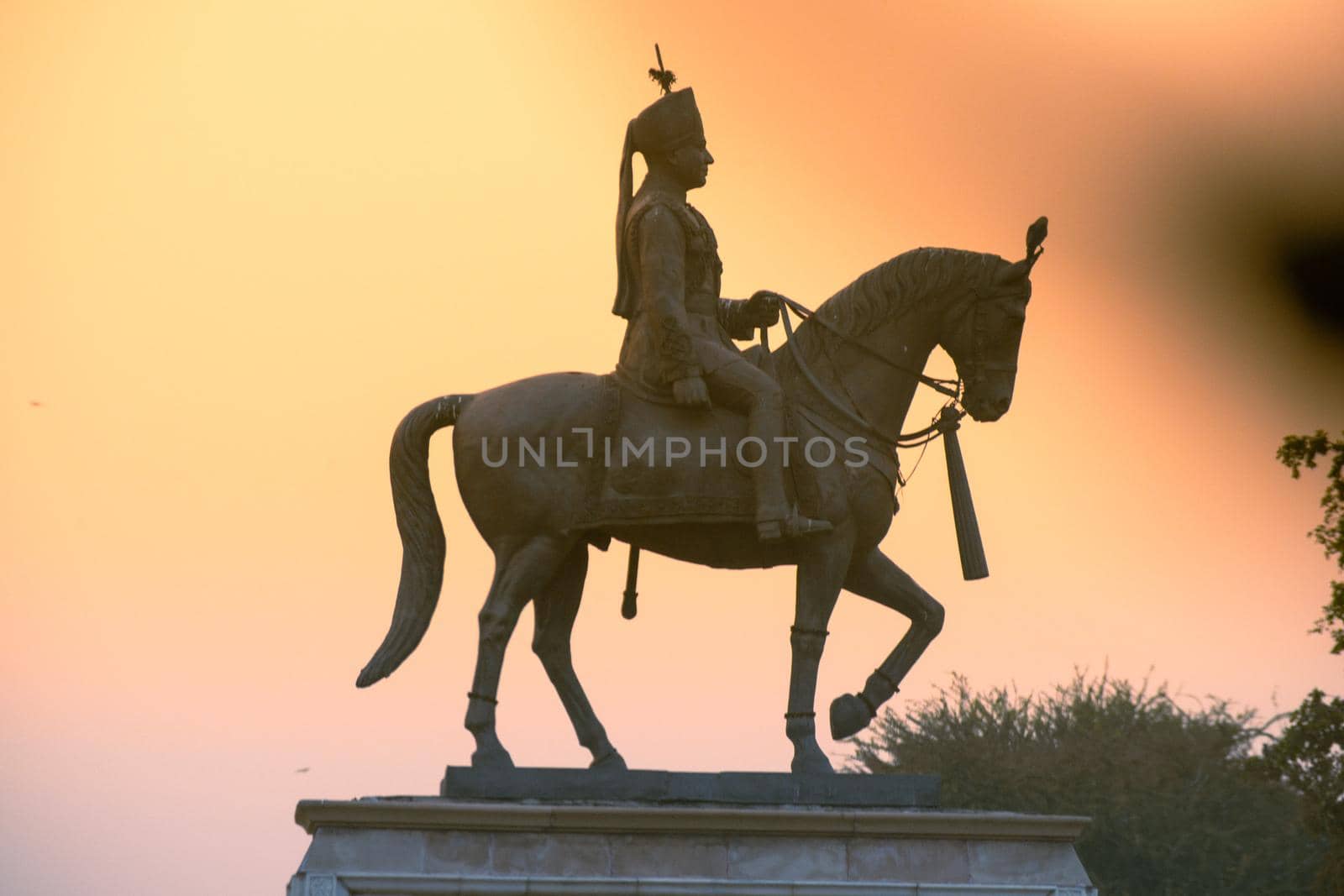 Madho singh statue with horse shot at dusk near albert hall in jaipur a landmark in the city and an often visited spot by Shalinimathur