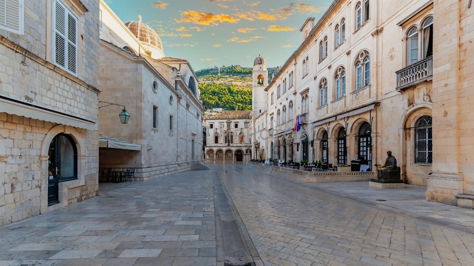 One of the main streets of the old town of Dubrovnik overlooking Mount Srd, Croatia. The street is empty because it is early morning and there are no tourists due to the pandemic.