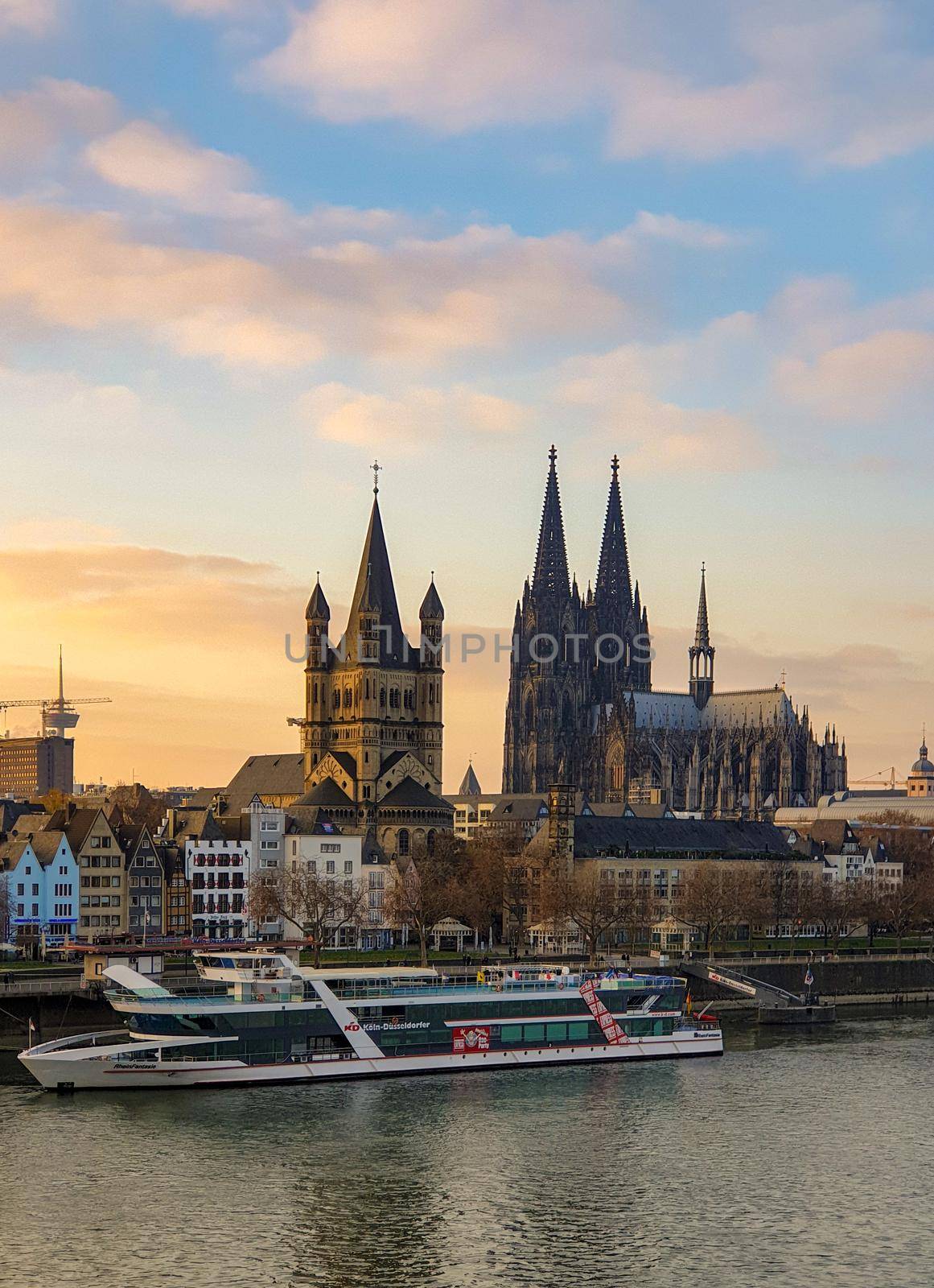 Cologne Germany November 2020, alongside the rhein river during sunset with the huge Cathedral in Koln