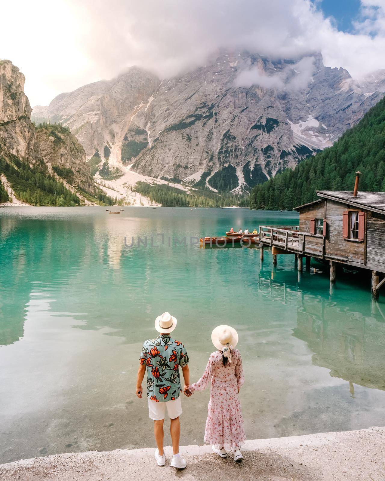 Beautiful lake in the italian alps, Lago di Braies, couple on vacation in the Italian Alps Italy by fokkebok