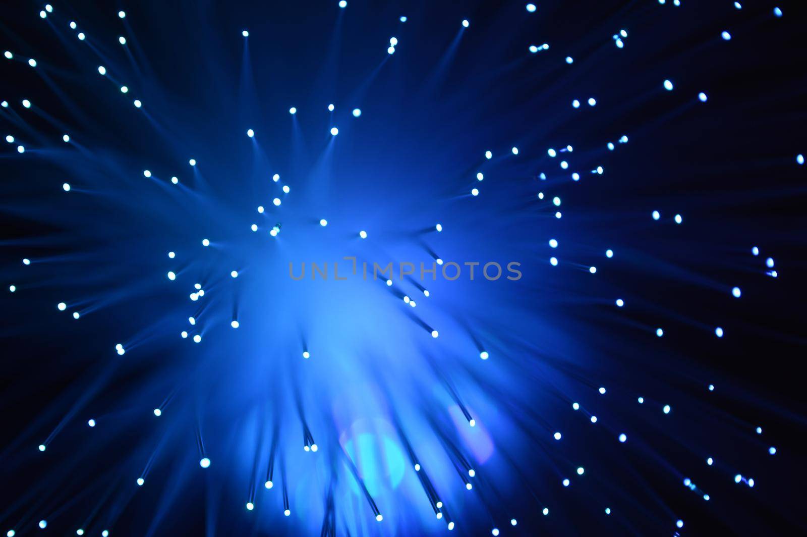 A blue abstract background from a series of color changing images of the same scene of fiber optic cables.