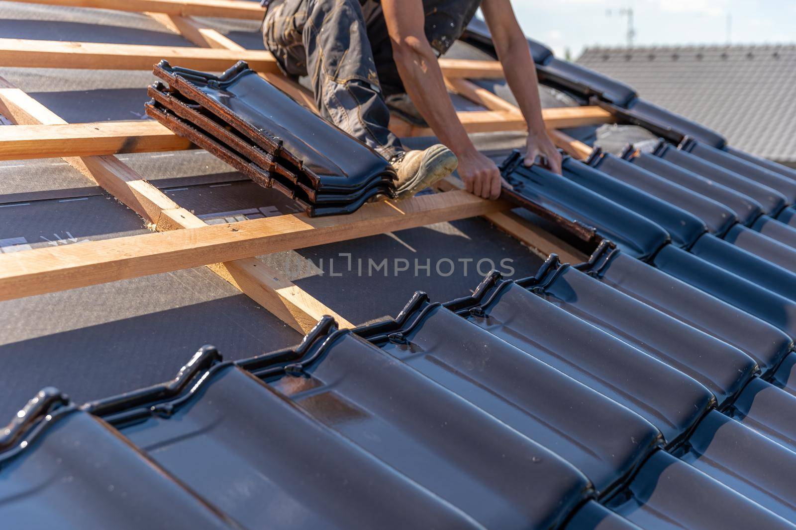 manufacture of the roof of a family house from ceramic tiles. copy space