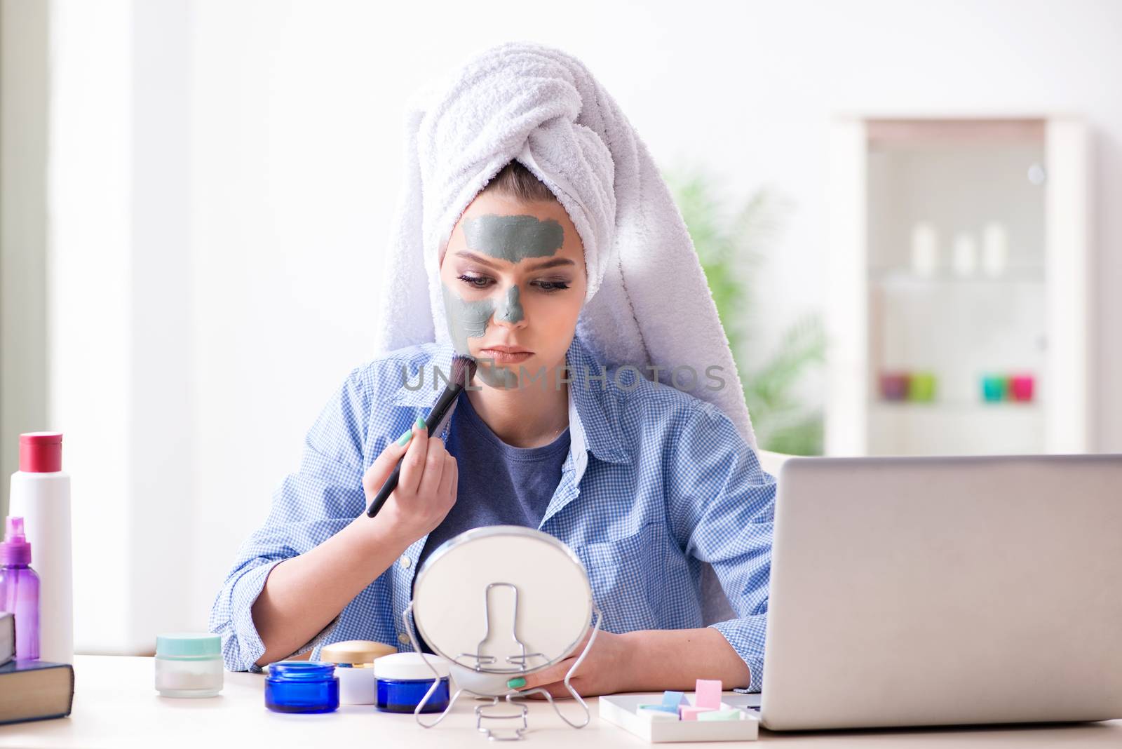 Beauty blogger applying mask and posting to internet blog by Elnur