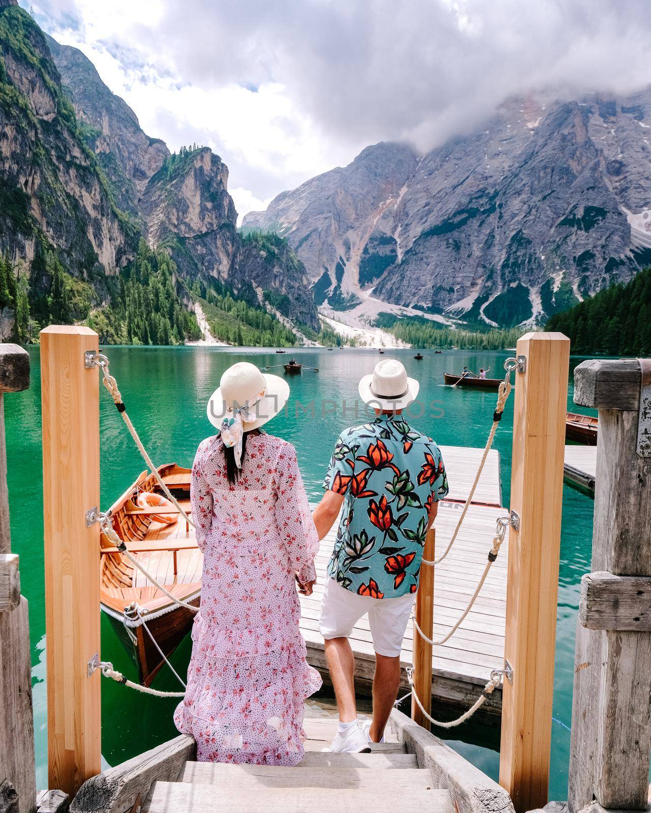 Beautiful lake in the italian alps, Lago di Braies, couple on vacation in the Italian Alps Italy by fokkebok