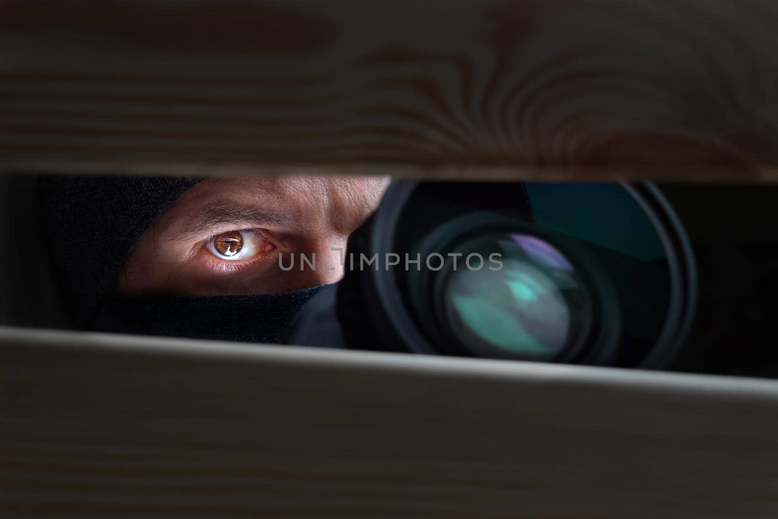 Spy Man. Peeping. Spying. Surveillance. Secret Information. Hidden Camera. Man hiding. Paparazzi. Stalker. Private Detective. Spy Camera. Spy Detective. Espionage. Privacy. Information. Investigation