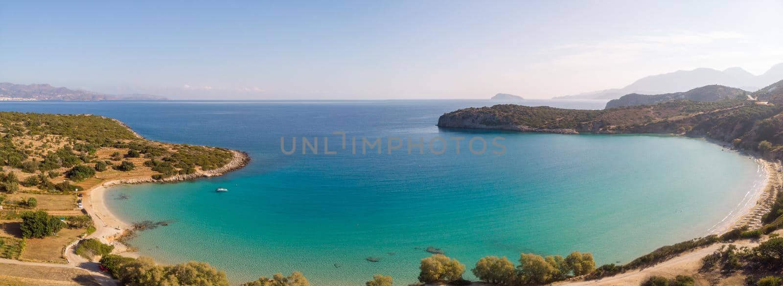 Tropical beach of Voulisma beach, Istron, Crete, Greece ,Most beautiful beaches of Crete island -Istron bay near Agios Nikolaos drone aerial view