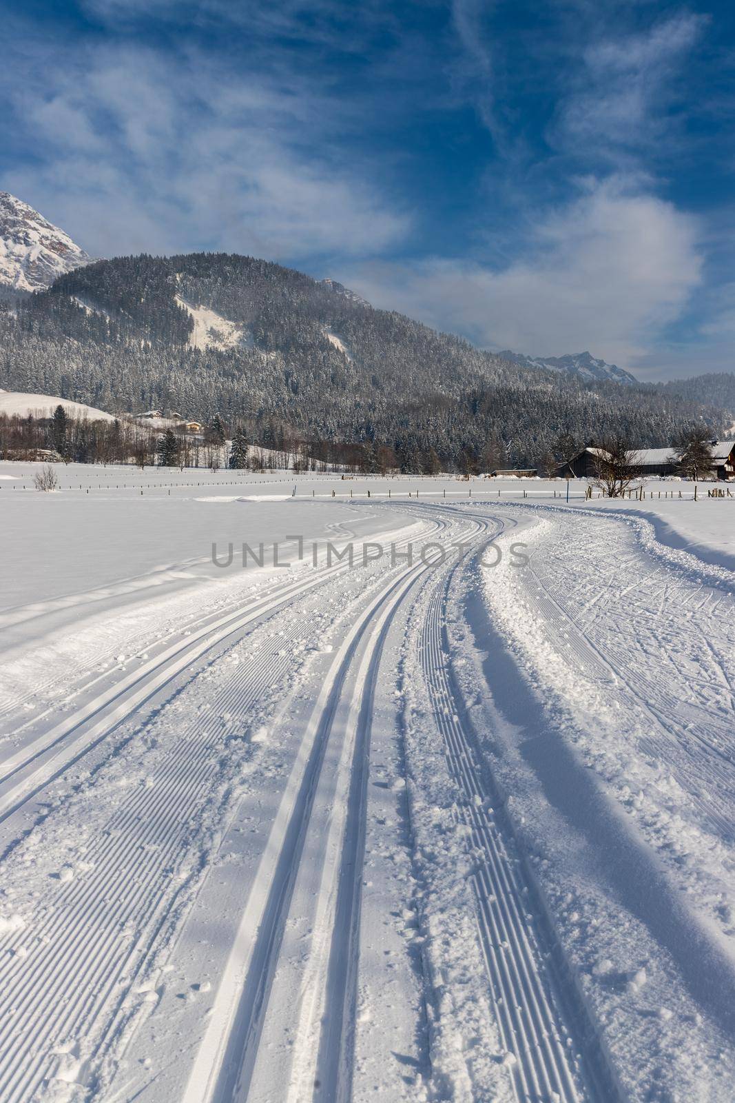 Cross-country skiing in Austria: Slope, fresh white powder snow and mountains by Daxenbichler