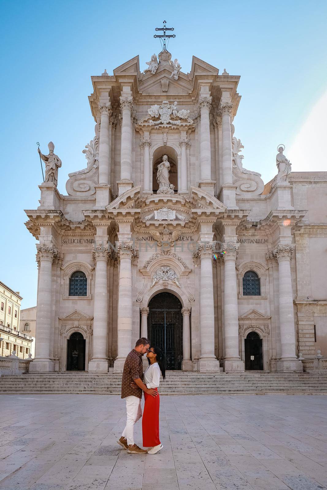 couple men and woman on citytrip, Ortigia in Syracuse Sicily Italy in the Morning. Travel Photography from Syracuse, Italy on the island of Sicily. 