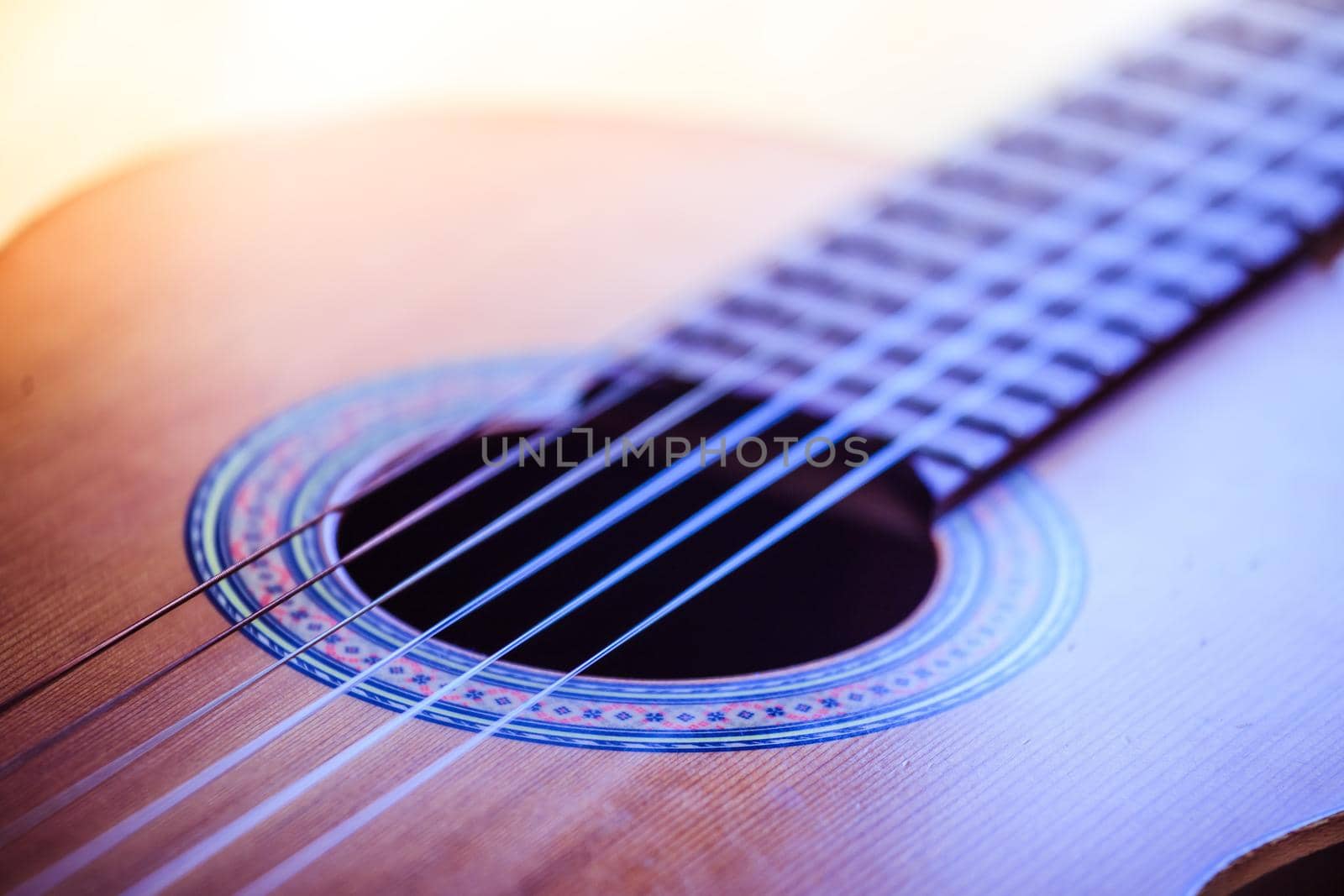 Cutout of a classical guitar corpus and strings, closeup