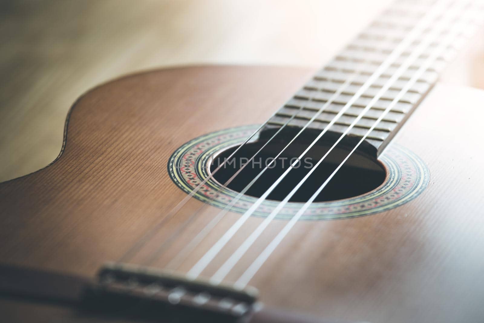 Cutout of a classical guitar corpus and strings, closeup