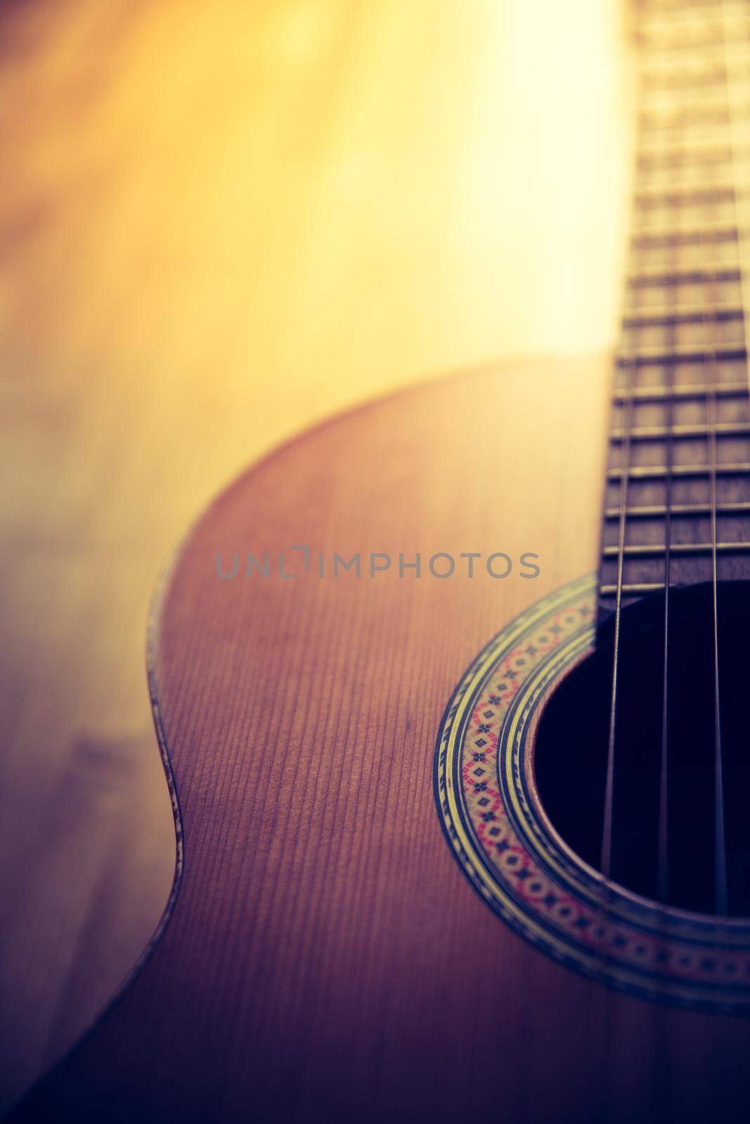 Cutout of a classical guitar corpus and strings, closeup