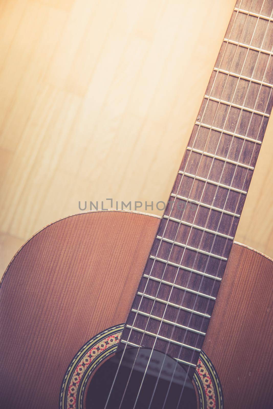 Cutout of a classical guitar corpus and strings, closeup