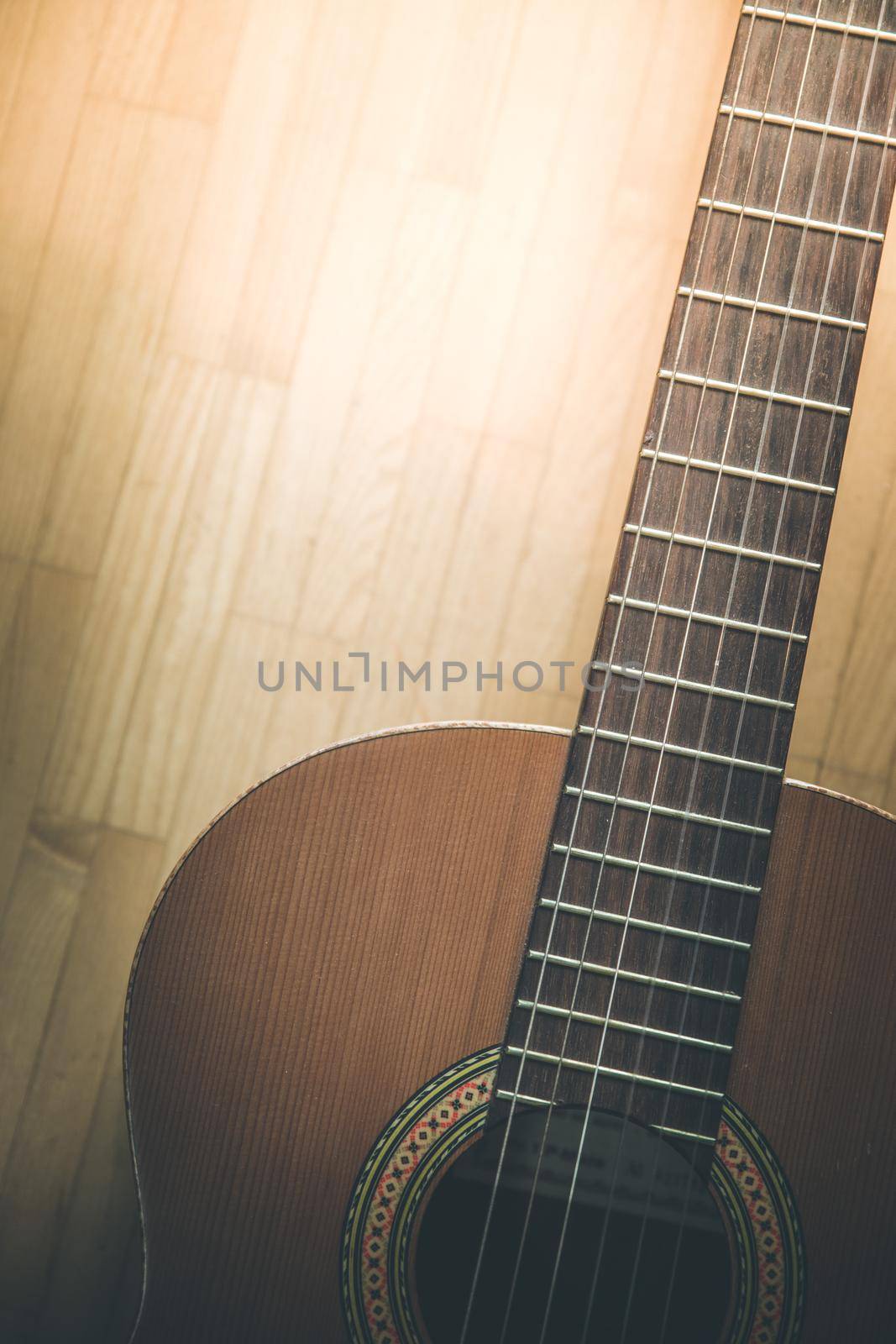 Cutout of a classical guitar corpus and strings, closeup