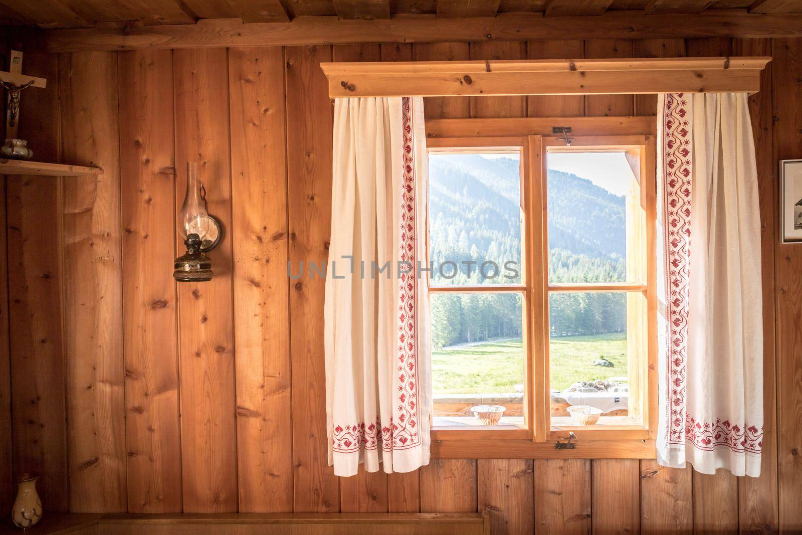 Holiday in the mountains: Rustic old wooden interior of a cabin or hut by Daxenbichler