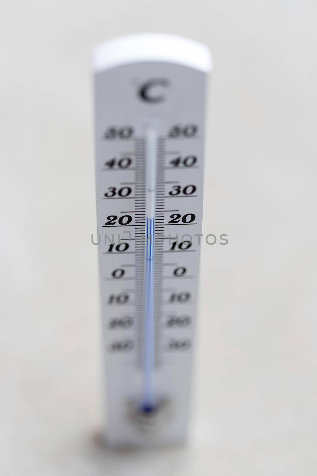 Thermometer close up picture in summer time, concrete floor