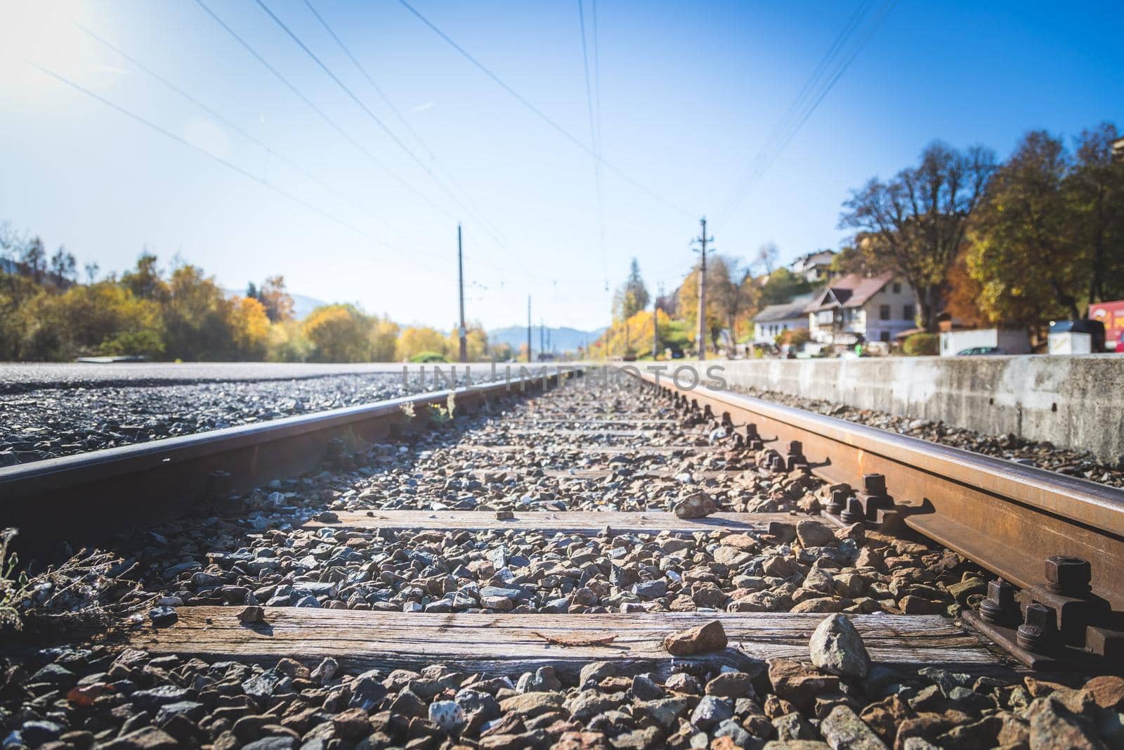 Landscape of an old abandoned railway in fall. Warm light, sustainable traveling