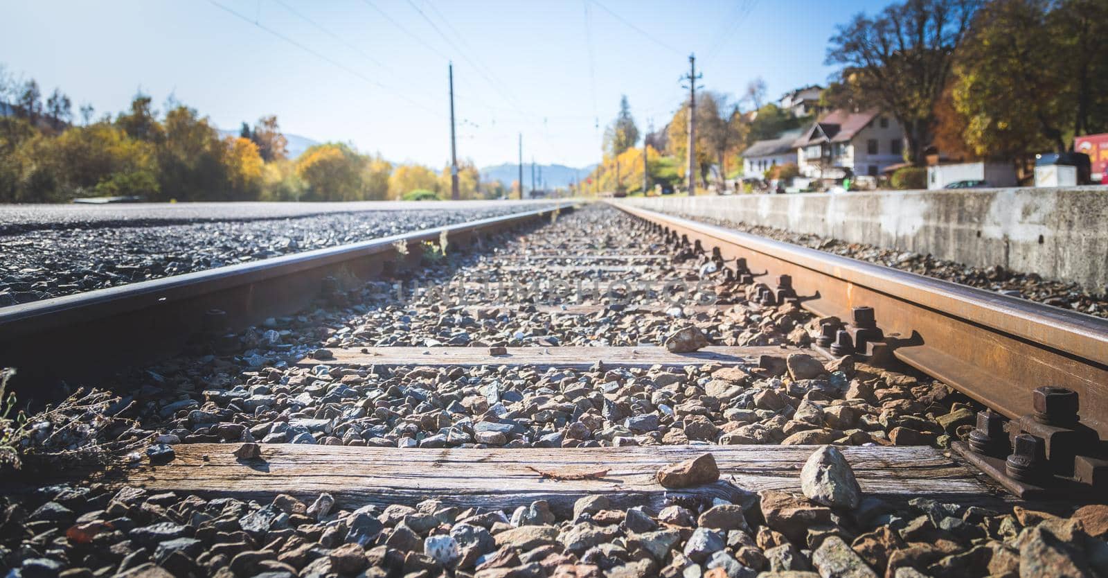 Landscape of an old abandoned railway in fall. Warm light, sustainable traveling
