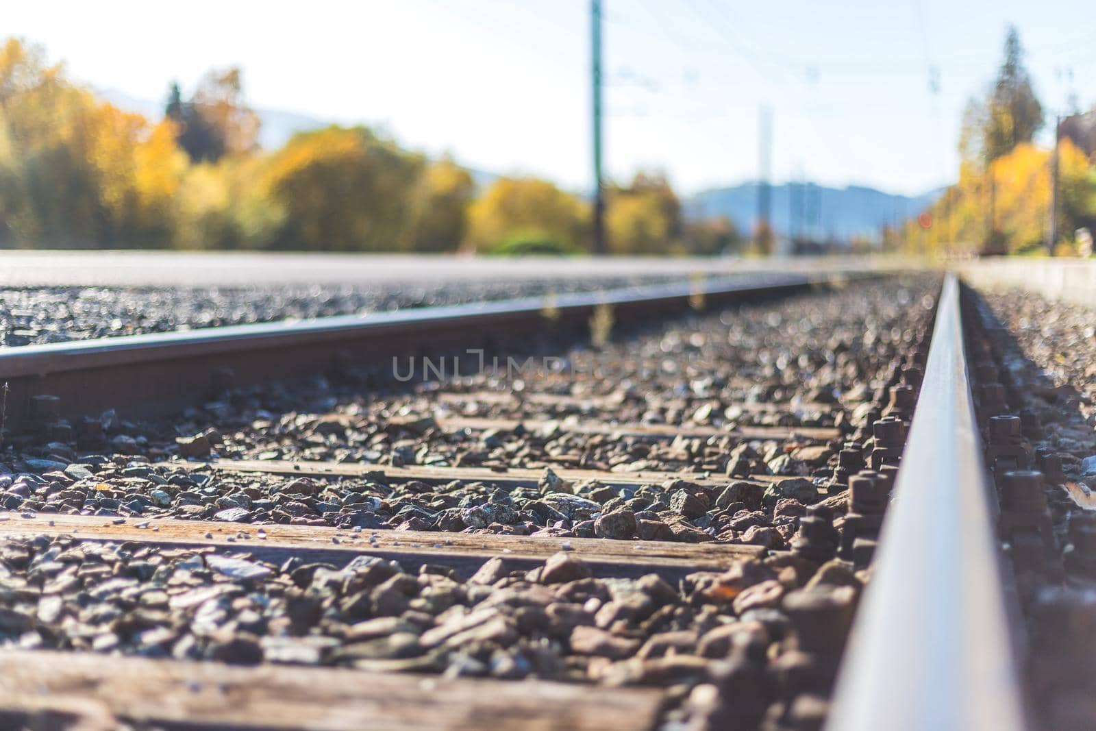 Landscape of an old abandoned railway in fall. Warm light, sustainable traveling