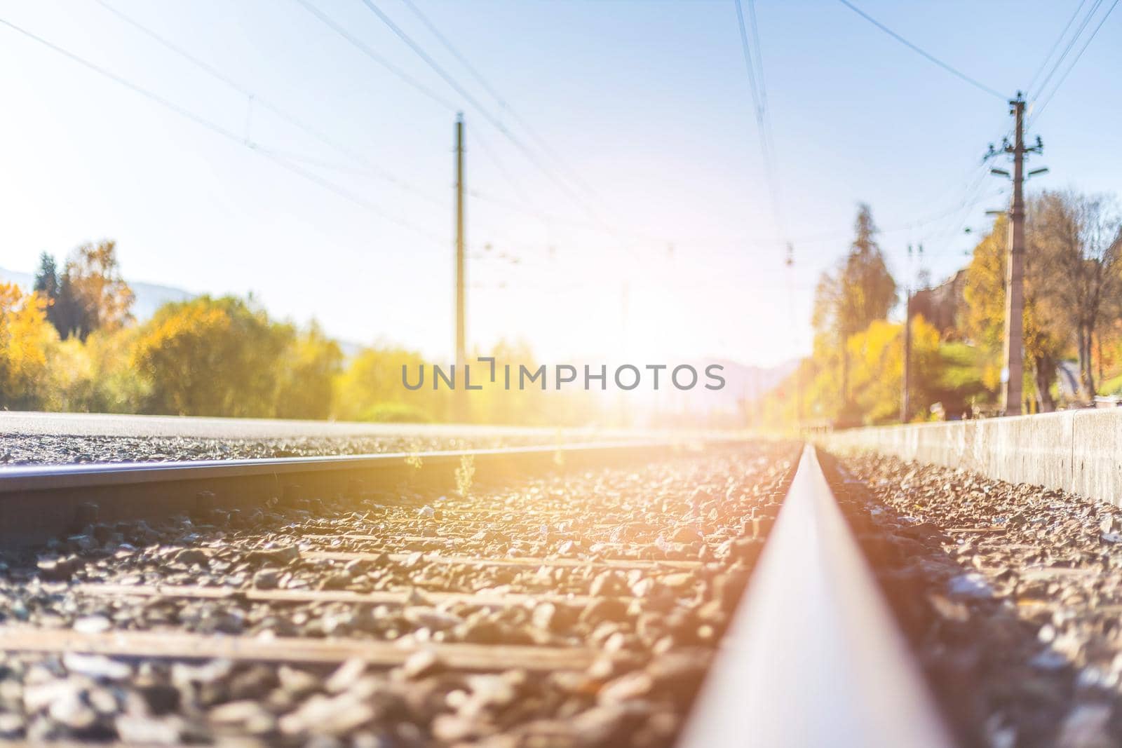 Landscape of an old abandoned railway in fall. Warm light, sustainable traveling
