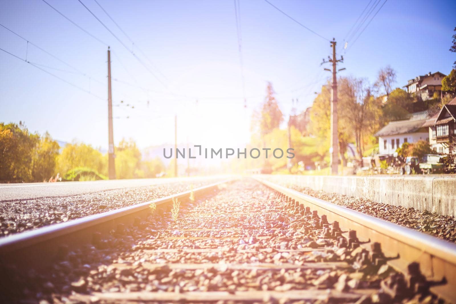 Landscape of an old abandoned railway in fall. Warm light, sustainable traveling