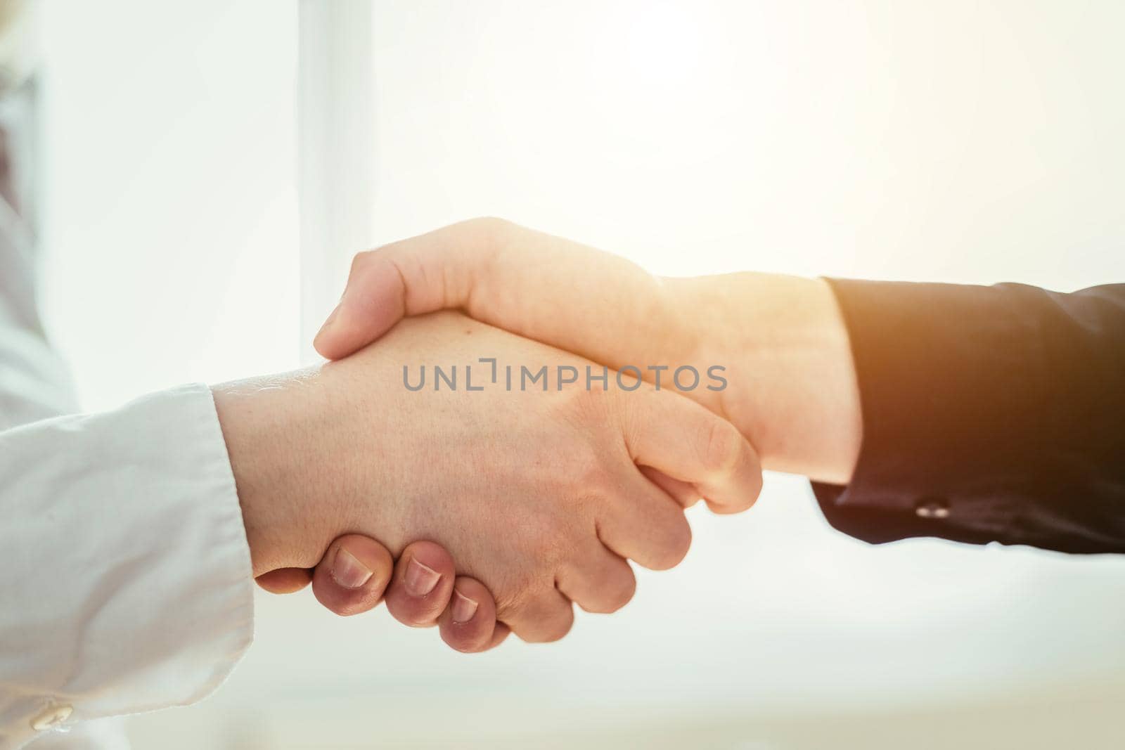 Man and woman are shaking hands, close up image, concept for human relationships