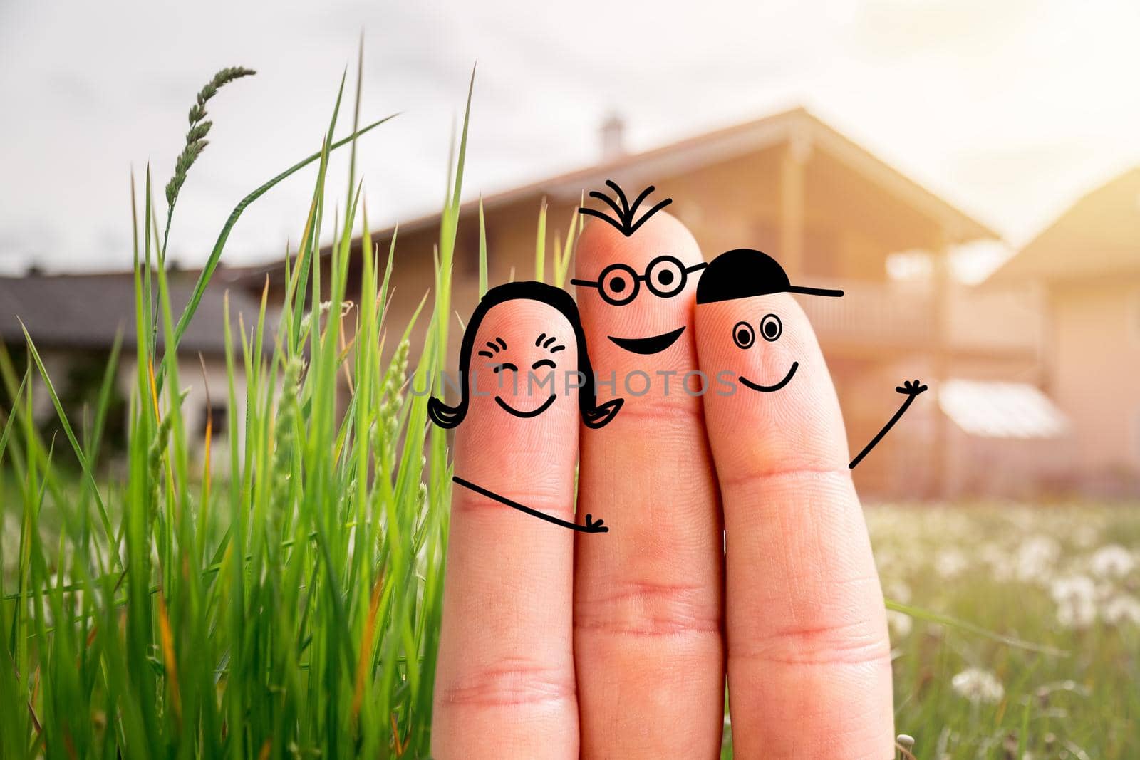 Painted fingers happy family concept moving into a new home