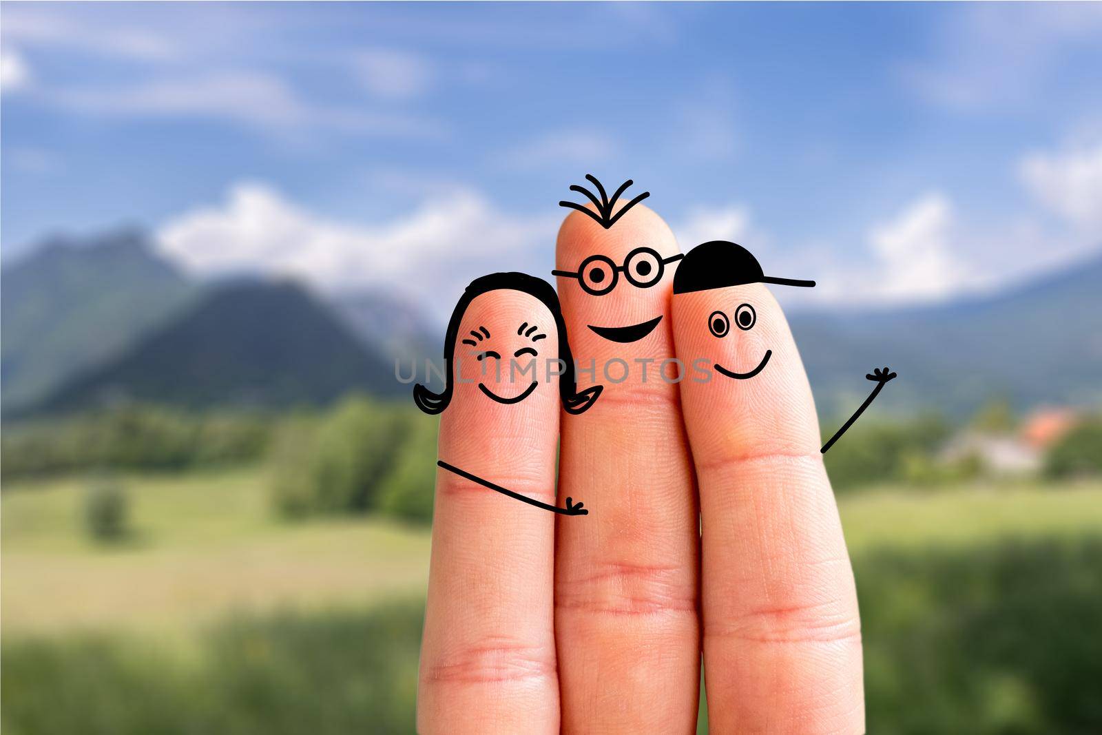 Painted fingers happy family concept making holidays in nature