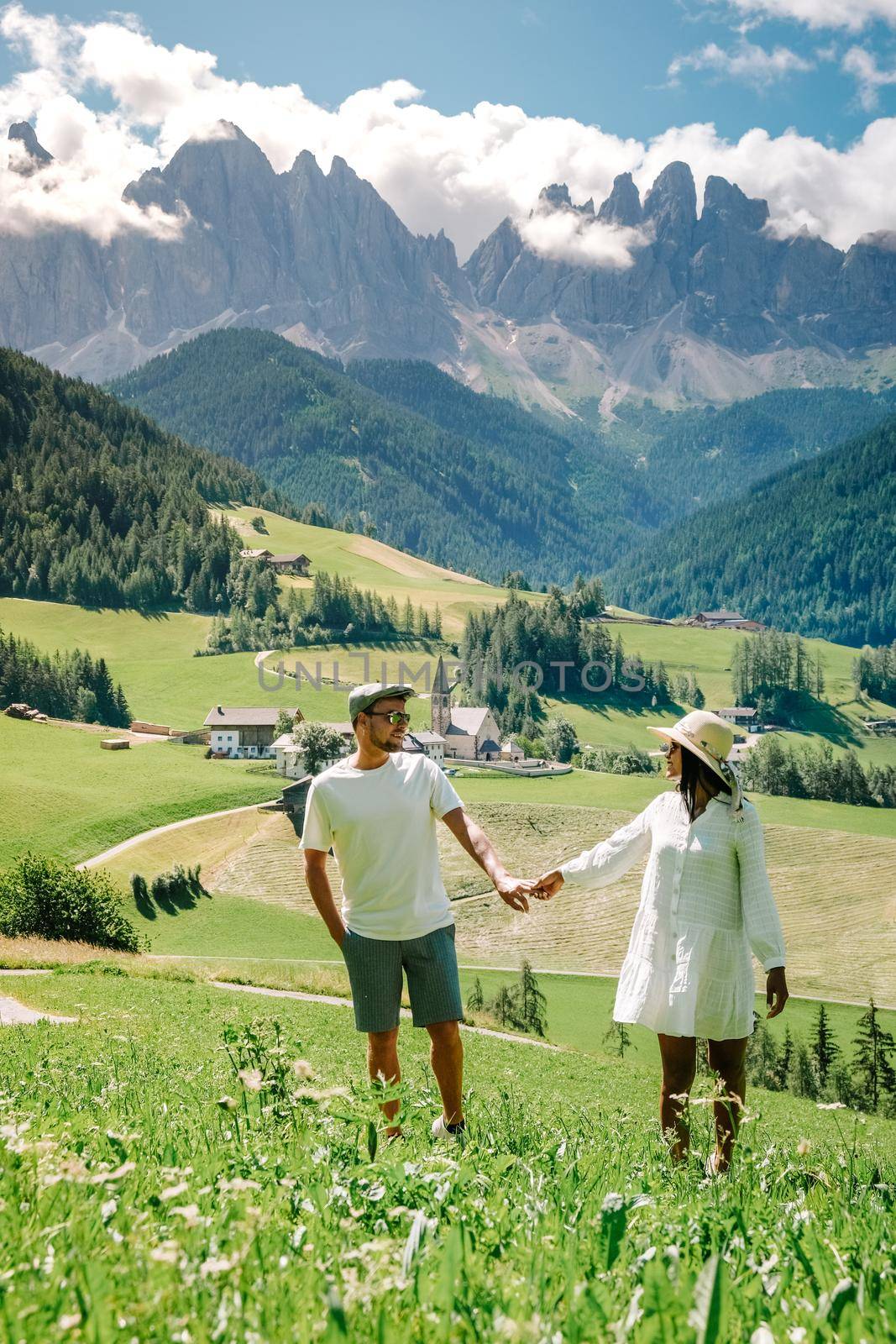 couple men and woman on vacation in the Italian Dolomites Italy. Europe