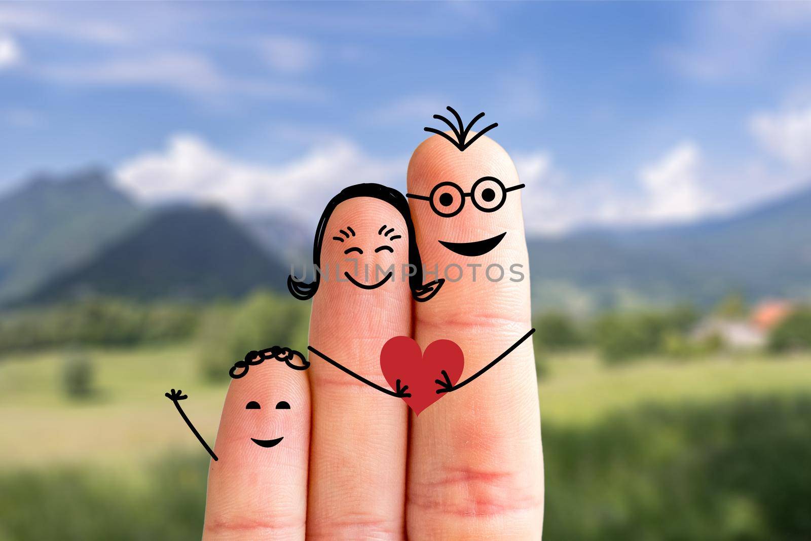 Painted fingers happy family concept making holidays in nature