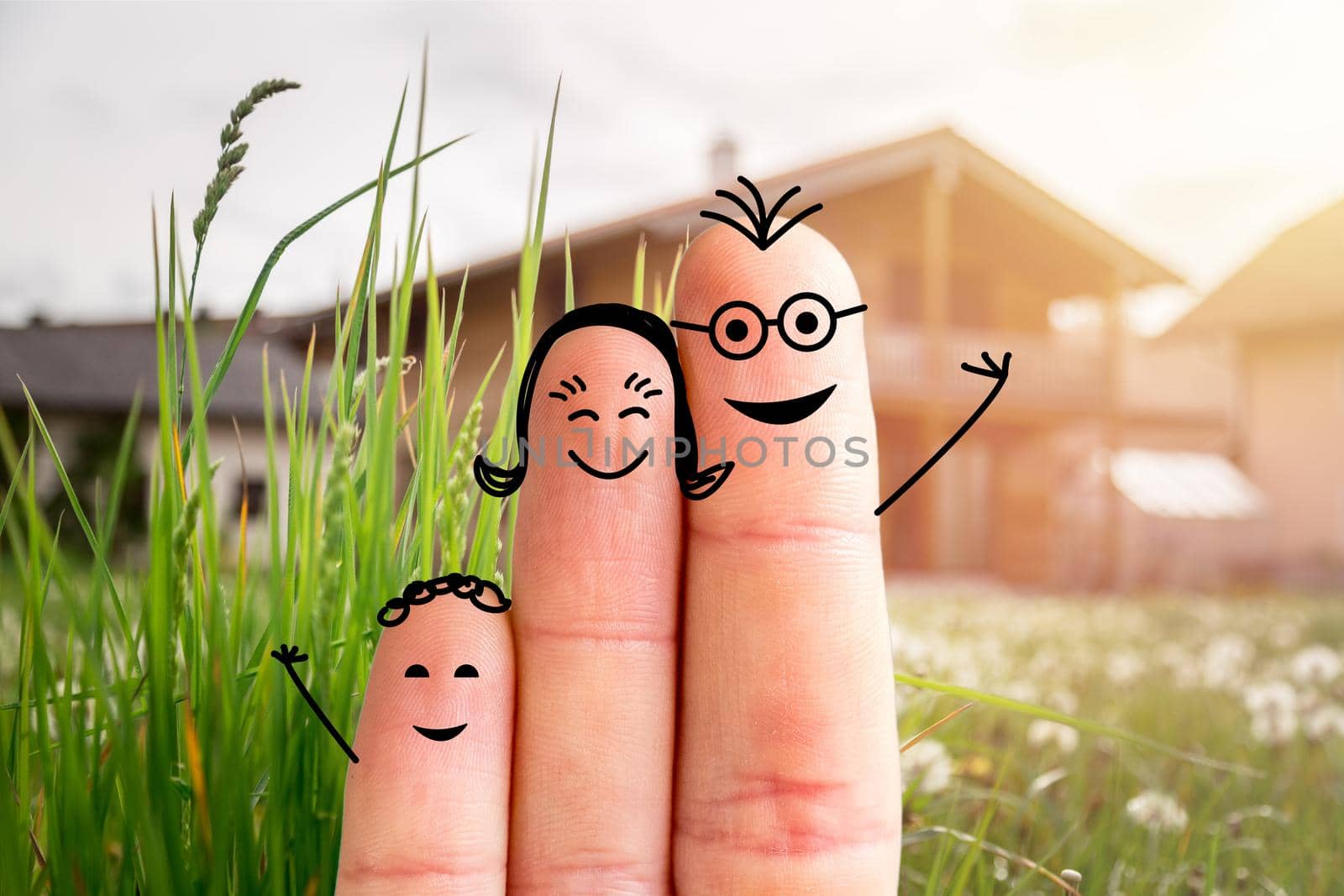 Painted fingers happy family concept moving into a new home